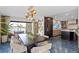 Open-concept dining and kitchen area with modern table and chairs, stylish lighting, and water views at 4900 59Th S Ave, St Petersburg, FL 33715