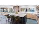 Bright, open kitchen with island seating, modern appliances, and scenic waterfront views at 4900 59Th S Ave, St Petersburg, FL 33715