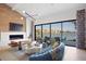 Bright living room with water views, modern fireplace, stylish furniture, and large sliding glass doors at 4900 59Th S Ave, St Petersburg, FL 33715