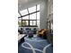 Stylish living room with high ceilings, a large window, comfortable seating, and a unique rug at 4900 59Th S Ave, St Petersburg, FL 33715
