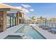 Gorgeous backyard pool overlooking the water, equipped with lounge chairs and a patio for relaxation at 4900 59Th S Ave, St Petersburg, FL 33715