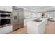 Modern kitchen showcasing stainless steel appliances, white cabinetry and countertop seating area at 5011 S Elberon St, Tampa, FL 33611