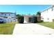 Charming single-story home featuring a well-maintained lawn and convenient carport at 602 Danube Ave, Tampa, FL 33606