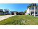 Well-manicured front lawn and appealing single-story house with a carport at 602 Danube Ave, Tampa, FL 33606