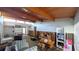 Spacious living room with wood-beam ceiling, flooded and stripped to the studs at 602 Danube Ave, Tampa, FL 33606
