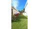 Neat side yard with healthy plants enhancing the property's appeal at 602 Danube Ave, Tampa, FL 33606
