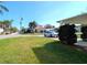Street view with lush green lawn and mature trees in a desirable neighborhood at 602 Danube Ave, Tampa, FL 33606