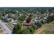 Aerial shot showcases the house amid lush green trees in a quiet residential neighborhood at 603 S Sylvan Dr, Brandon, FL 33510