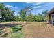 The backyard features mature trees and a lush, spacious yard at 603 S Sylvan Dr, Brandon, FL 33510