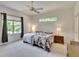 Bedroom with natural lighting and neutral decor and ceiling fan at 603 S Sylvan Dr, Brandon, FL 33510