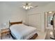 Comfortable bedroom features a ceiling fan, closet, and an ensuite bathroom for added privacy at 603 S Sylvan Dr, Brandon, FL 33510