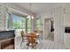 Breakfast nook features white tile flooring, views to the exterior, and wood table at 603 S Sylvan Dr, Brandon, FL 33510