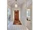 Bright foyer with tile flooring and a decorative wreath at the front door at 603 S Sylvan Dr, Brandon, FL 33510