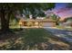 Charming brick home features a spacious front yard and a two-car garage at 603 S Sylvan Dr, Brandon, FL 33510