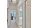 Hallway view leading to a bathroom and bedroom, offering lots of natural light from the windows throughout at 603 S Sylvan Dr, Brandon, FL 33510