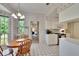 Kitchen and breakfast nook with white cabinets and exterior views at 603 S Sylvan Dr, Brandon, FL 33510