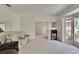 Spacious living room with neutral carpet, bay window, and comfortable seating at 603 S Sylvan Dr, Brandon, FL 33510