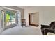 Bright living room features neutral carpet, a large window, and comfortable seating at 603 S Sylvan Dr, Brandon, FL 33510