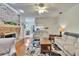 Cozy living room with fireplace, hardwood floors, and views to the kitchen at 603 S Sylvan Dr, Brandon, FL 33510