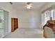 Bright home office with white walls, light carpet, built-in shelves and lots of natural light at 603 S Sylvan Dr, Brandon, FL 33510