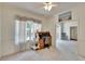 Bright home office with large window and view, a wooden desk and neutral walls and carpet at 603 S Sylvan Dr, Brandon, FL 33510