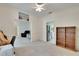 A bright carpeted office shows built-in shelves, an open doorway, and is adjacent to the kitchen at 603 S Sylvan Dr, Brandon, FL 33510