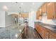 Spacious kitchen with granite countertops, stainless steel appliances and wood-look tile flooring at 6539 Salt Creek Ave, Apollo Beach, FL 33572