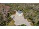 Aerial view of the detached garage with a private driveway and ample parking at 6615 Ridge Top Dr, New Port Richey, FL 34655