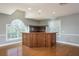 Large entertainment room showcasing a wood bar area with seating and shelving at 6615 Ridge Top Dr, Trinity, FL 34655
