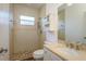 Well-lit bathroom with a walk-in shower and updated vanity at 6615 Ridge Top Dr, Trinity, FL 34655