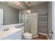 Bathroom with a white vanity, a glass shower, and tiled floors at 6615 Ridge Top Dr, Trinity, FL 34655