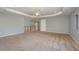 Large bonus room that connects to the upstairs hallway, with neutral carpet, recessed lights, and tray ceilings at 6615 Ridge Top Dr, Trinity, FL 34655