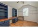 Well-lit bonus room featuring built-in shelving and desk space at 6615 Ridge Top Dr, Trinity, FL 34655