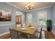 Formal dining room features modern furnishings and an abundance of natural light at 6615 Ridge Top Dr, Trinity, FL 34655