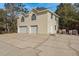Exterior view of a two-story home with a large driveway and two-car garage at 6615 Ridge Top Dr, Trinity, FL 34655