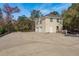 Exterior view of a two-story home with a large driveway and two-car garage at 6615 Ridge Top Dr, Trinity, FL 34655