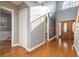 Light-filled foyer with hardwood floors, elegant entryway, and access to various rooms at 6615 Ridge Top Dr, Trinity, FL 34655