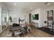 Spacious home gym featuring a treadmill, elliptical, rowing machine, and weight rack at 6615 Ridge Top Dr, Trinity, FL 34655