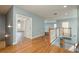 Bright, airy hallway with hardwood floors and a view of the living spaces on the second floor at 6615 Ridge Top Dr, Trinity, FL 34655