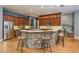 Open concept kitchen with stone-clad breakfast bar and stainless steel appliances at 6615 Ridge Top Dr, Trinity, FL 34655