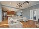 Spacious living room boasts hardwood floors and an open floor plan to the kitchen at 6615 Ridge Top Dr, Trinity, FL 34655