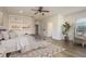 Sun-lit main bedroom with wood floors, built-in shelves, and a calm, neutral color palette at 6615 Ridge Top Dr, Trinity, FL 34655
