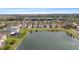Aerial view of the neighborhood featuring a community pond, highlighting 7086 Chatum Light Run address at 7086 Chatum Light Run, Bradenton, FL 34212