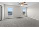 Bright bedroom featuring large windows with water views, enhancing the natural light and space at 7086 Chatum Light Run, Bradenton, FL 34212