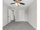 Neat, gray bedroom with a double closet and adjoining door offers comfortable living space at 7086 Chatum Light Run, Bradenton, FL 34212