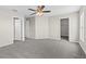 Spacious bedroom with neutral carpet and ceiling fan, offering a blank canvas for personalization at 7086 Chatum Light Run, Bradenton, FL 34212
