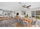 Dining area featuring breakfast bar and updated kitchen at 7086 Chatum Light Run, Bradenton, FL 34212
