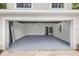 Spacious two-car garage with clean epoxy floor at 7086 Chatum Light Run, Bradenton, FL 34212