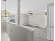 Neutral loft area with large windows, ceiling fan, and plenty of light at 7086 Chatum Light Run, Bradenton, FL 34212