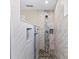Shower with marble walls, mosaic accents, and dual shower heads at 7086 Chatum Light Run, Bradenton, FL 34212